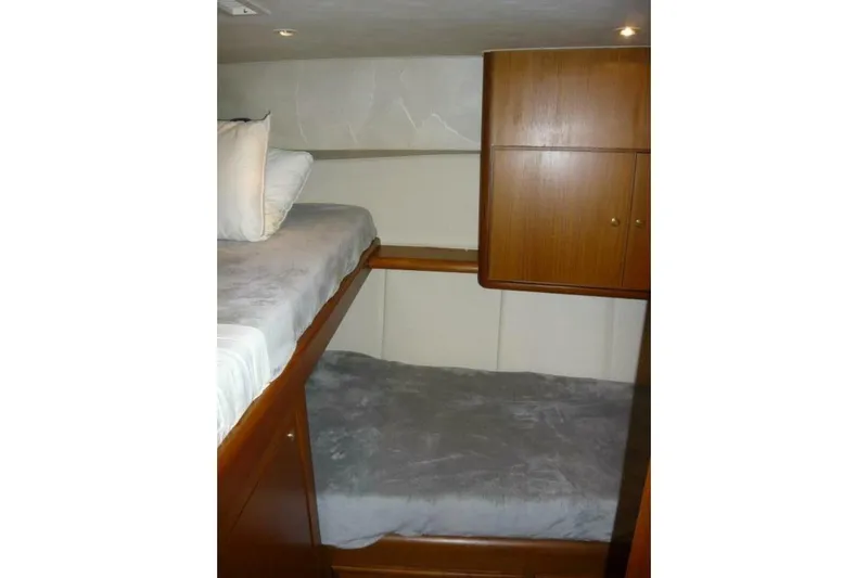 Bella Donna Yacht Photos Pics 1999 Ocean Yachts 56 interior with wooden bunk beds and storage cabinets.
