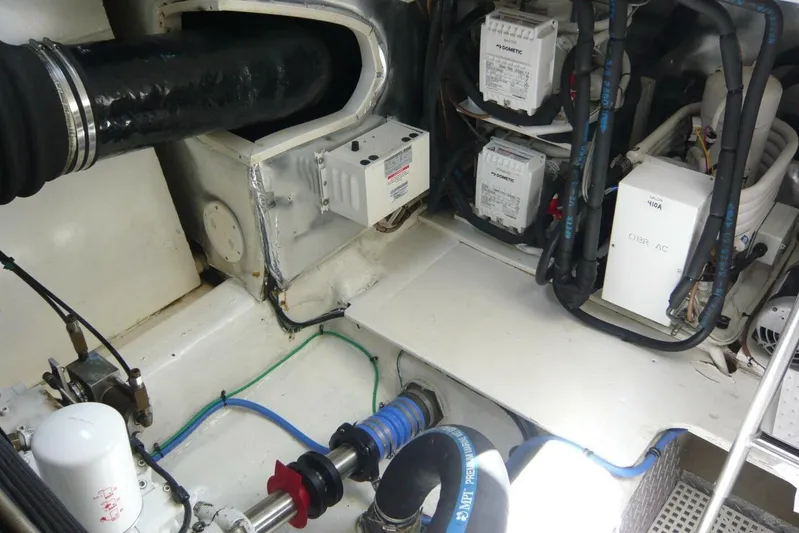 Bella Donna Yacht Photos Pics Engine room of 1999 Ocean Yachts 56, featuring mechanical components and wiring.
