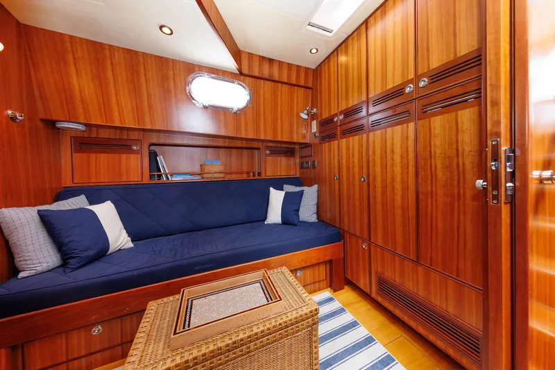 Independence Yacht Photos Pics Luxurious 2009 Hunt Yachts 52 Express interior with wood paneling and cozy seating area.