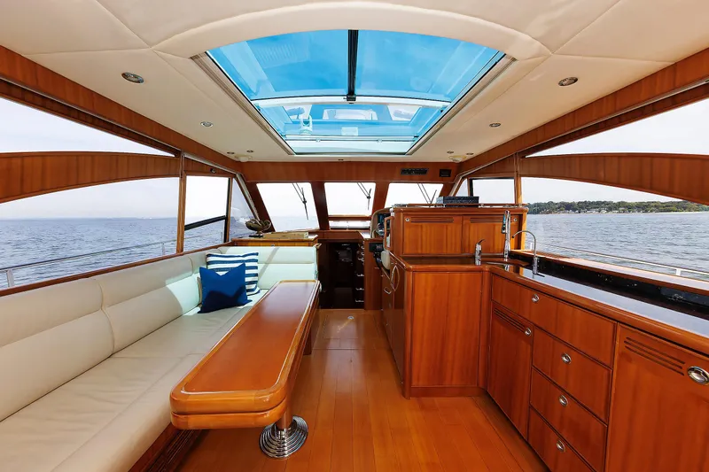 Independence Yacht Photos Pics Luxurious interior of 2009 Hunt Yachts 52 Express with wood finish and ocean view.
