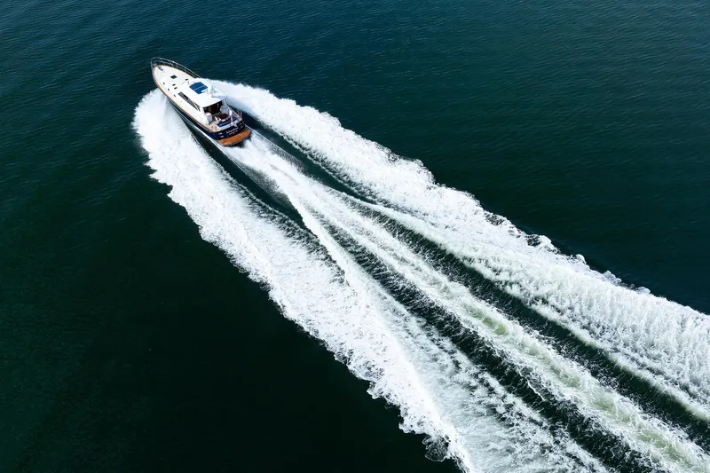 Independence Yacht Photos Pics Aerial view of 2009 Hunt Yachts 52 Express cruising on open water.