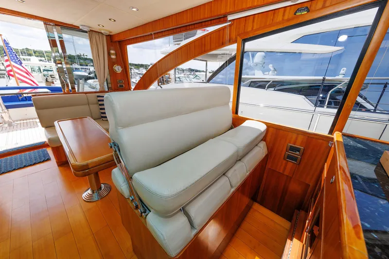 Independence Yacht Photos Pics Luxurious interior of 2009 Hunt Yachts 52 Express with elegant seating and wooden finishes.