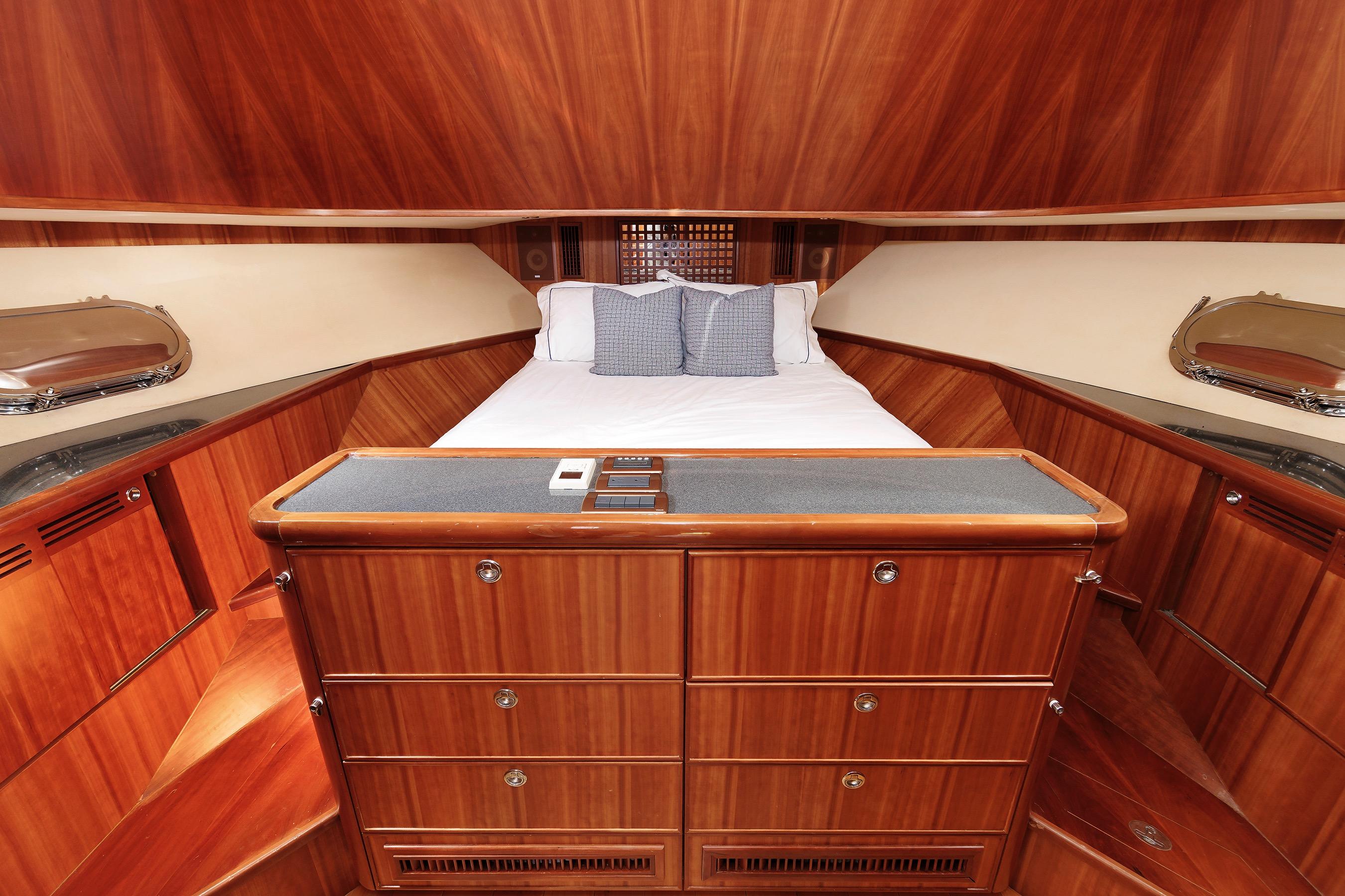 Luxurious cabin interior of 2009 Hunt Yachts 52 Express with elegant wood finish.