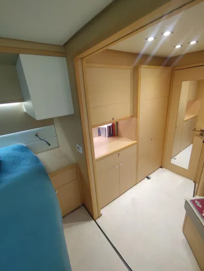 Bada Bing Yacht Photos Pics Interior of 2014 Lagoon 52 yacht with modern wood cabinetry and soft lighting.