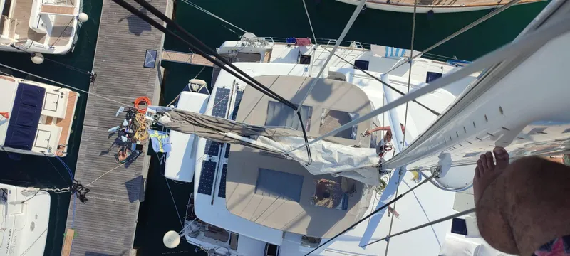 Bada Bing Yacht Photos Pics Aerial view of a 2014 Lagoon 52 catamaran docked at a marina.