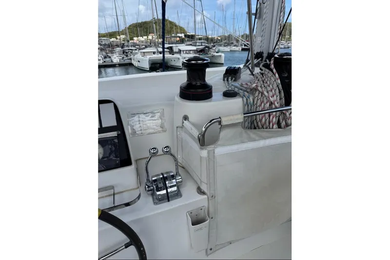  Yacht Photos Pics Cockpit of 2018 Lagoon 42 sailboat with winch and control panel in marina.