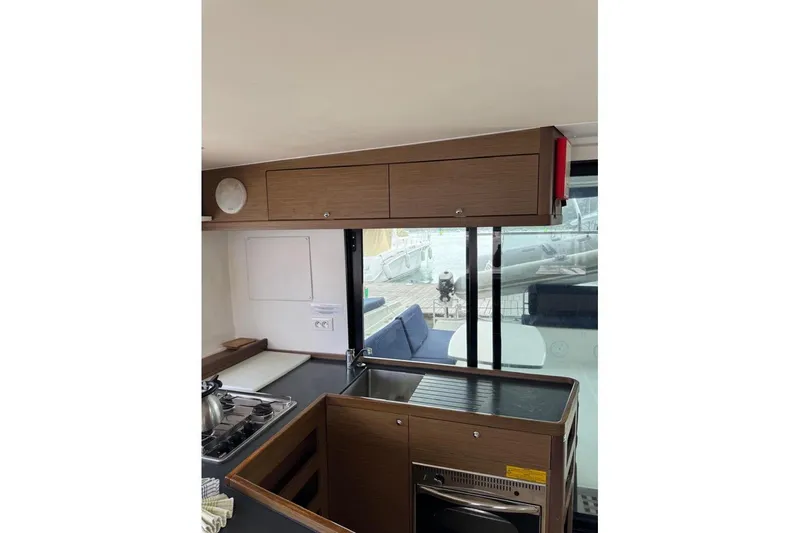  Yacht Photos Pics Interior of 2018 Lagoon 42 catamaran kitchen with modern cabinetry and appliances.