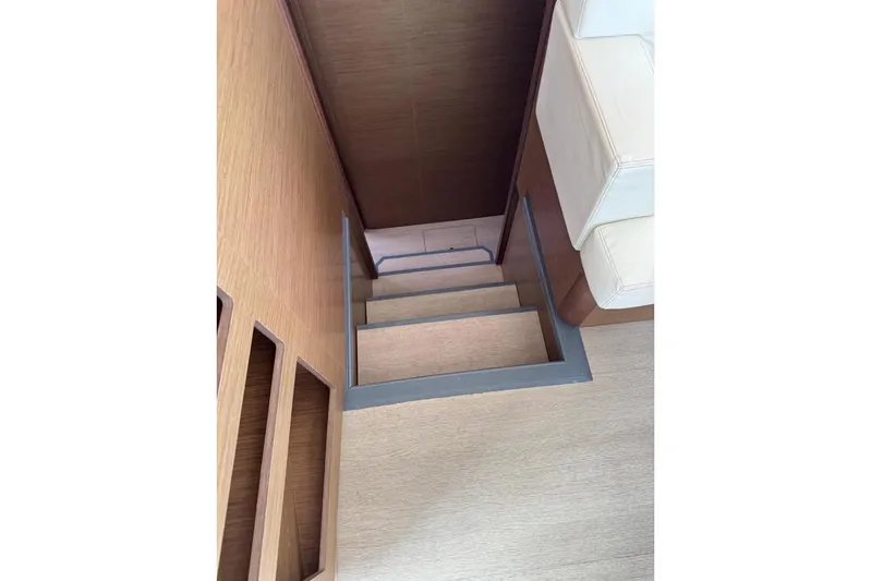  Yacht Photos Pics Staircase inside 2018 Lagoon 42 yacht, featuring wooden steps and modern design.