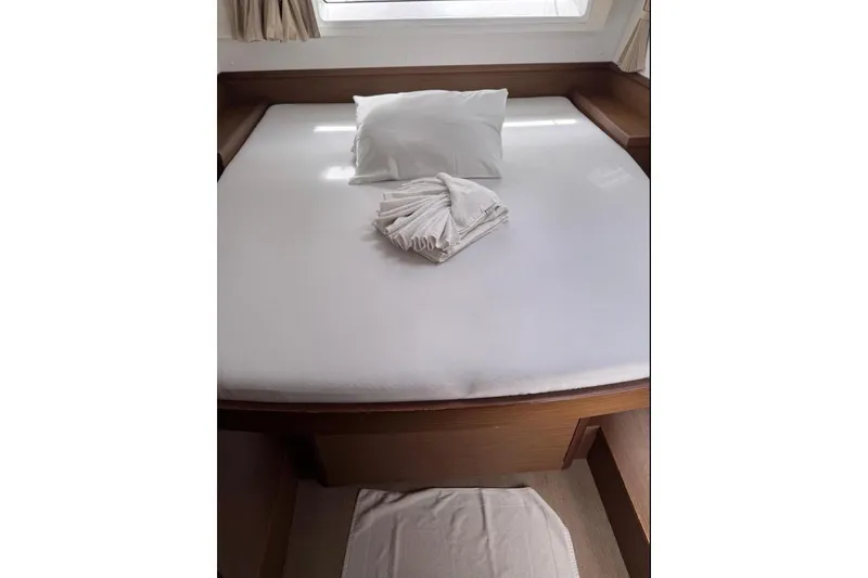  Yacht Photos Pics Cozy cabin bed in 2018 Lagoon 42 yacht with white linens and pillow.