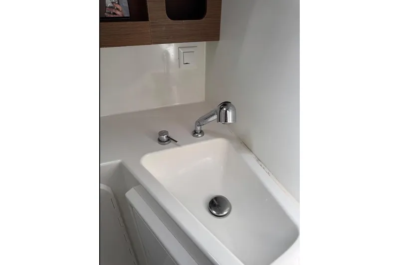  Yacht Photos Pics Modern sink in 2018 Lagoon 42 yacht bathroom, featuring sleek faucet and minimalist design.