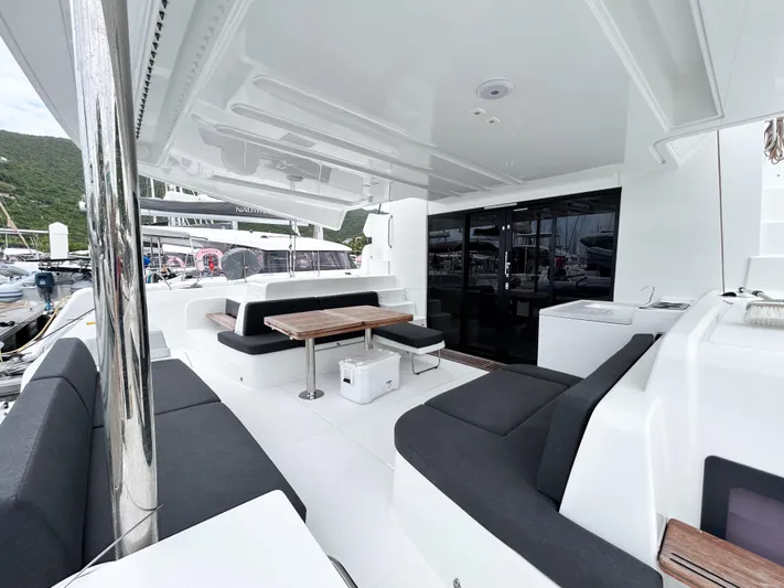 Slinky Malinki Yacht Photos Pics Luxurious 2025 Lagoon 51 yacht interior with sleek seating and modern design.