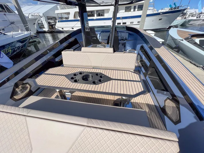Say Carbon Yachts 42 Yacht Photos Pics 2023 SAY Carbon Yachts 42, luxury yacht interior with beige seating and wooden table.