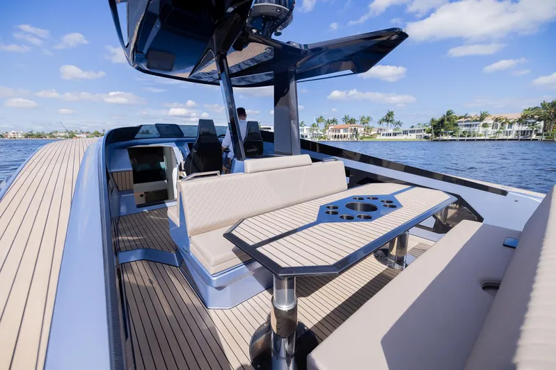 Say Carbon Yachts 42 Yacht Photos Pics 2023 SAY Carbon Yachts 42 luxury deck with seating and table on a sunny day.
