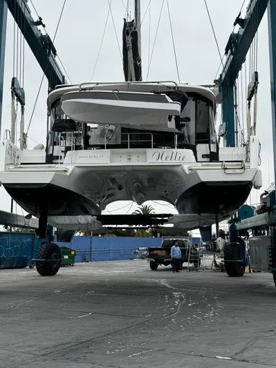 Nellie Yacht Photos Pics Lagoon 42 catamaran from 2020 in a boatyard lift, ready for maintenance.