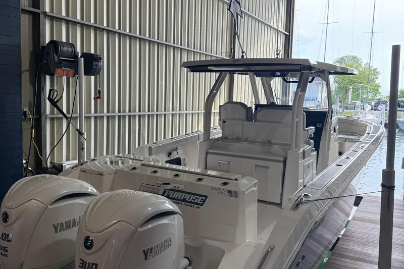  Yacht Photos Pics 2022 Pursuit S 328 Sport boat with Yamaha engines in a marina setting.