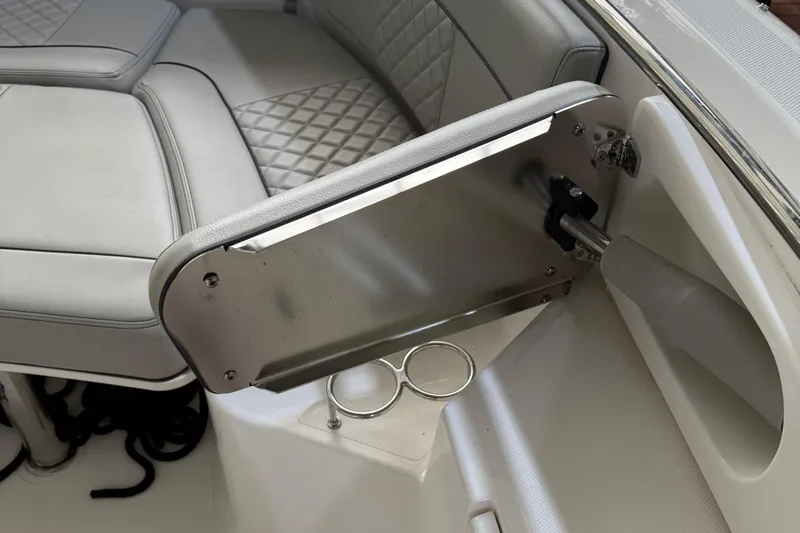  Yacht Photos Pics 2022 Pursuit S 328 Sport boat interior with cushioned seating and stainless steel cup holders.