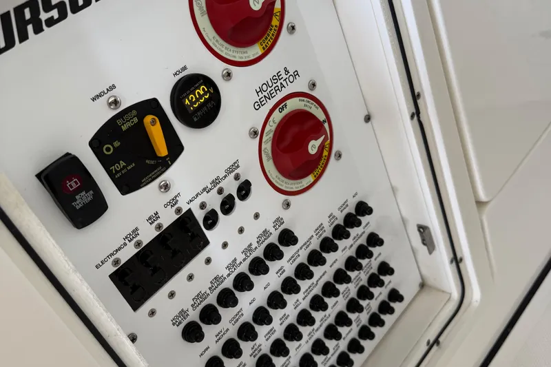  Yacht Photos Pics Control panel of 2022 Pursuit S 328 Sport boat with switches and gauges.