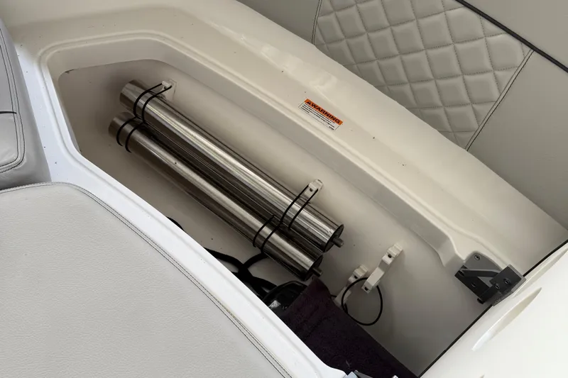  Yacht Photos Pics Storage compartment in 2022 Pursuit S 328 Sport boat with stainless steel rods.