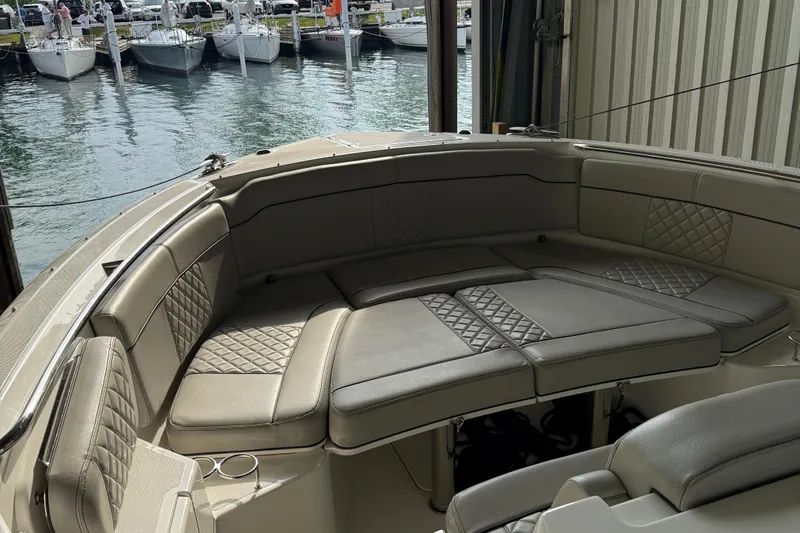  Yacht Photos Pics Luxurious seating on 2022 Pursuit S 328 Sport boat, docked near marina.