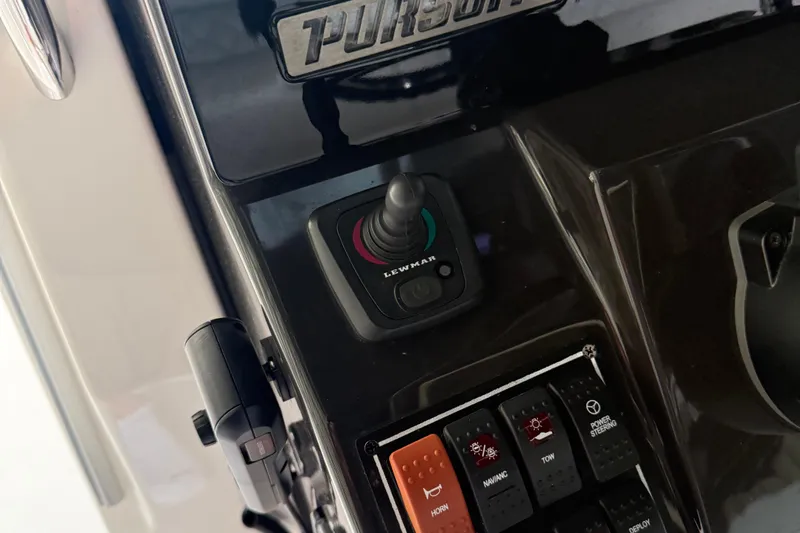  Yacht Photos Pics Control panel of 2022 Pursuit S 328 Sport boat with joystick and switches.
