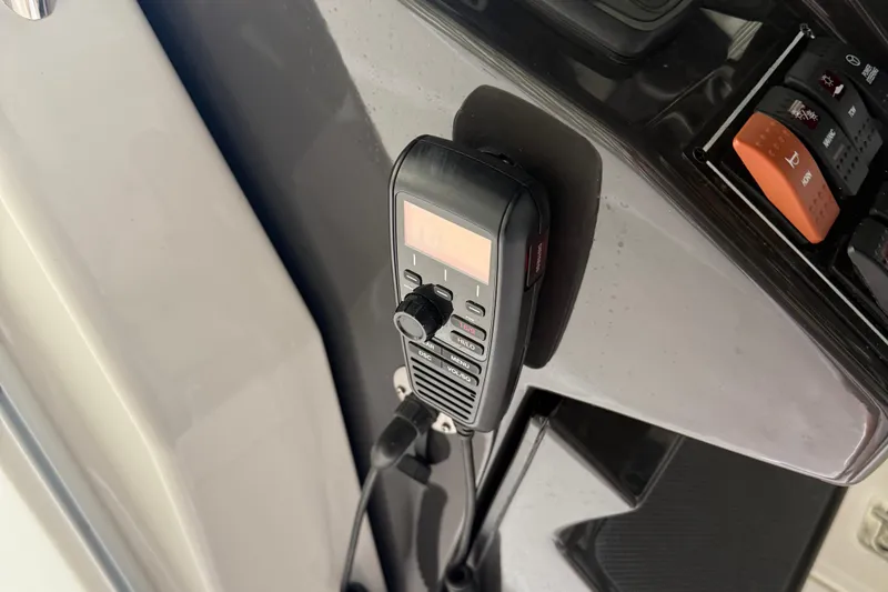  Yacht Photos Pics VHF radio on 2022 Pursuit S 328 Sport boat dashboard.