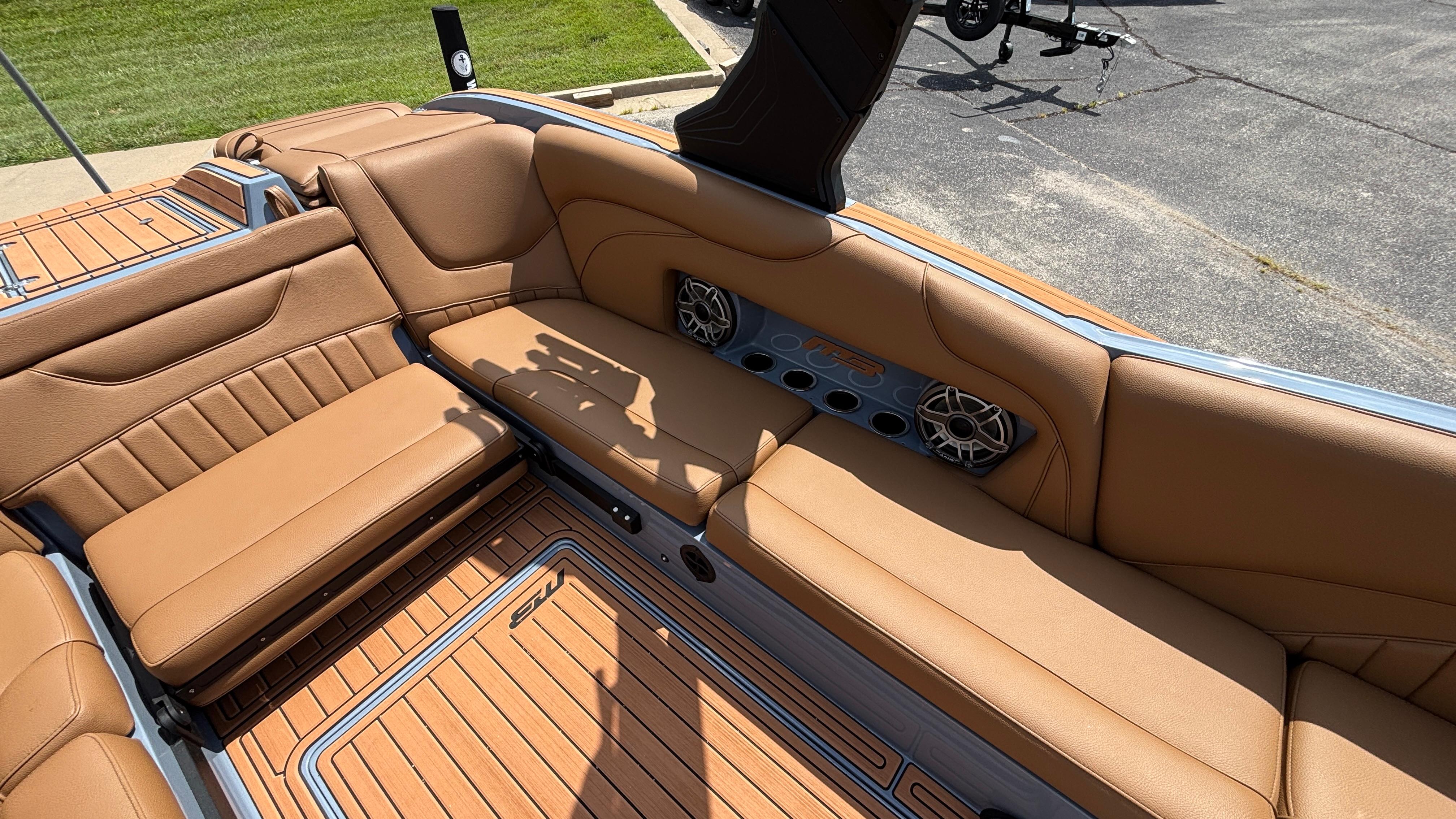 Luxurious interior of 2025 MB B52 23 Alpha boat with tan leather seating.