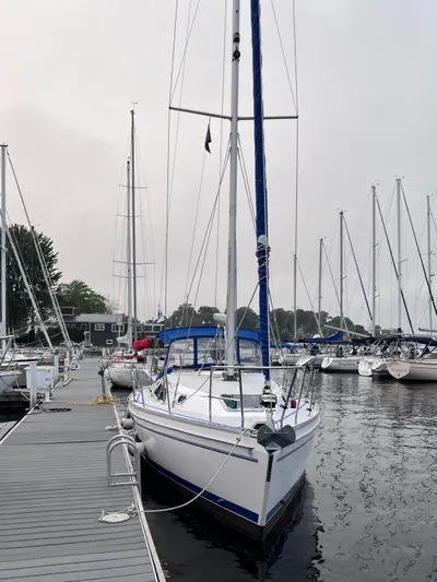 Amadeus Yacht Photos Pics Sailboat Catalina 355, 2014 model, docked at marina with overcast sky.