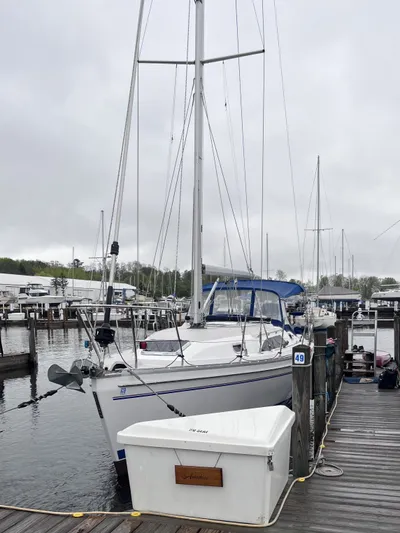 Amadeus Yacht Photos Pics Sailboat docked at marina, Catalina 355, 2014 model, overcast sky.