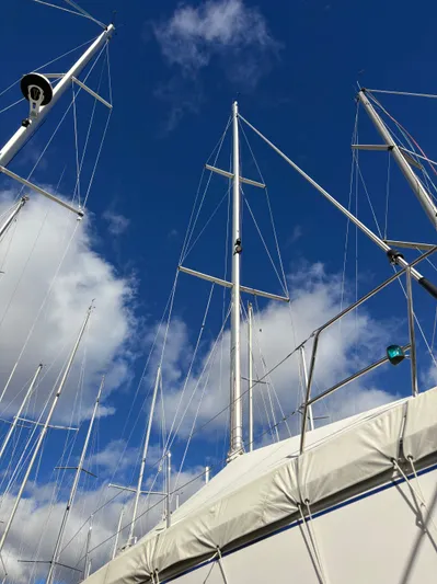 Amadeus Yacht Photos Pics Sailboat masts against a blue sky, Catalina 355, 2014 model.