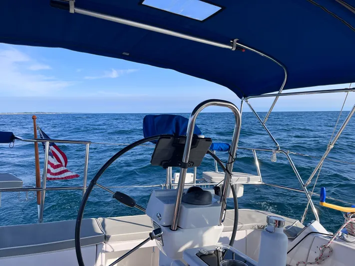 Amadeus Yacht Photos Pics Sailing on a 2014 Catalina 355 yacht with ocean view and American flag.