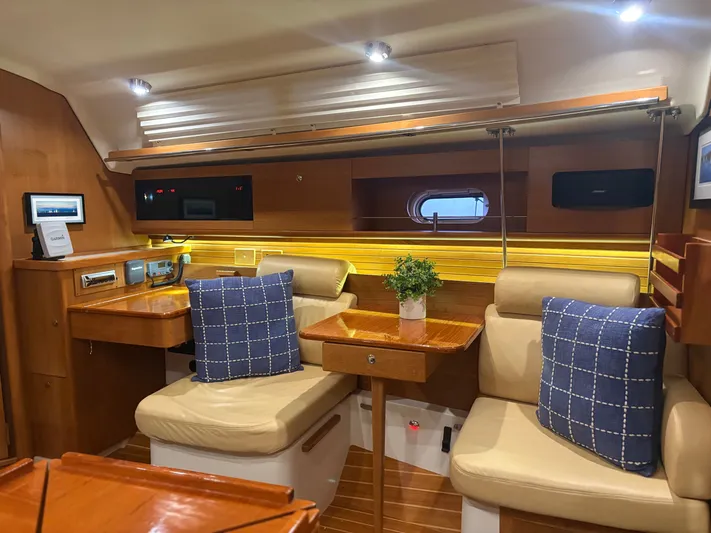 Amadeus Yacht Photos Pics Luxurious interior of a 2014 Catalina 355 yacht with cozy seating and elegant decor.