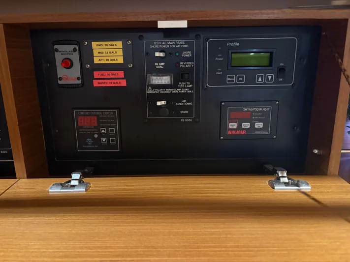 Amadeus Yacht Photos Pics Control panel of a 2014 Catalina 355 sailboat, featuring gauges and switches.