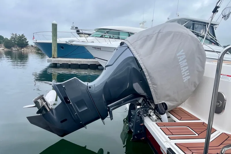  Yacht Photos Pics 2023 Ranger Tugs R-27 with Yamaha outboard motor, docked in a marina.