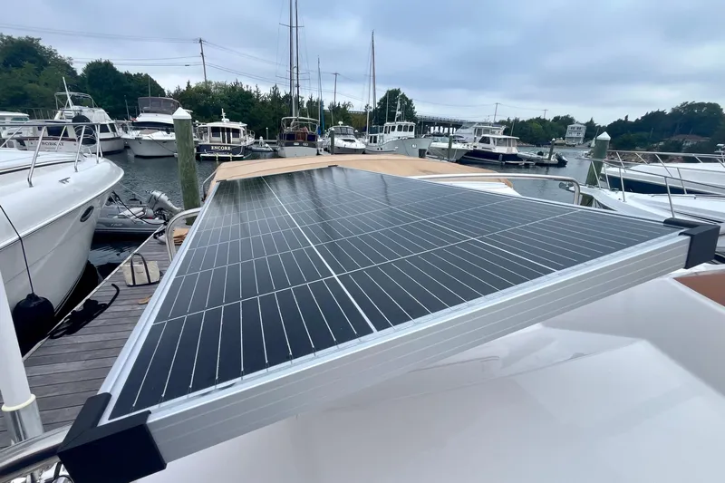  Yacht Photos Pics 2023 Ranger Tugs R-27 with solar panel, docked among other boats.