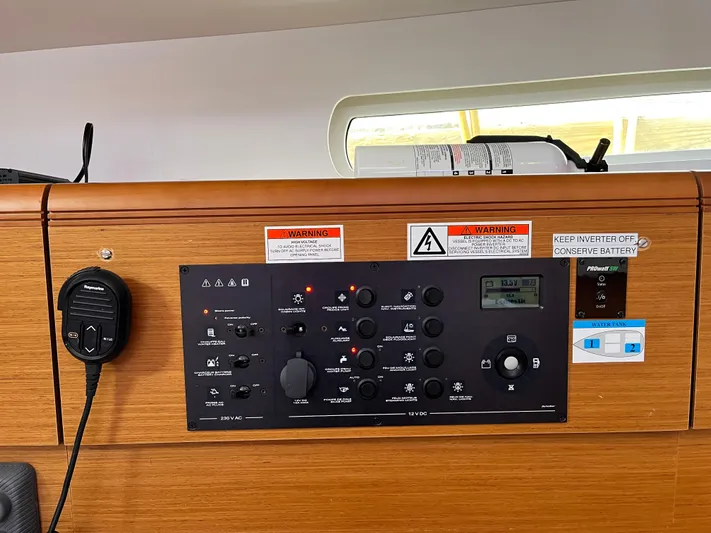Reaching Heaven Yacht Photos Pics Control panel of a 2019 Jeanneau Sun Odyssey 389 sailboat, featuring various switches and indicators.