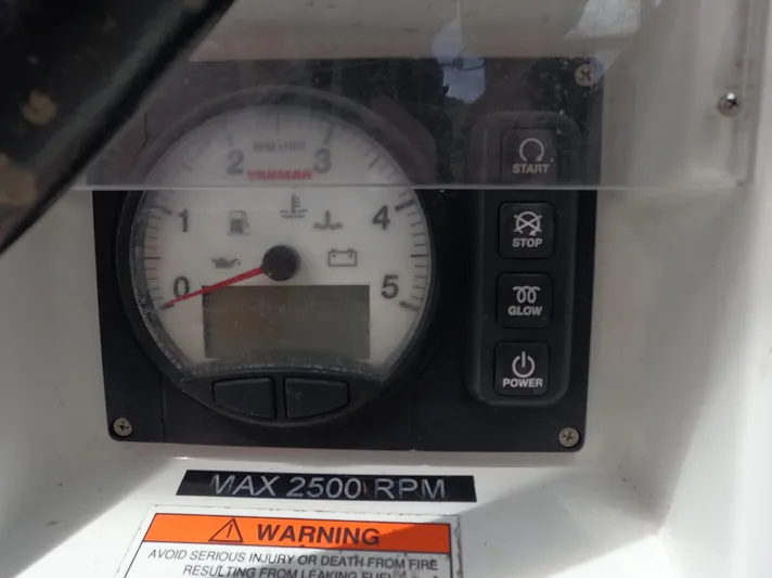 Reaching Heaven Yacht Photos Pics Control panel of 2019 Jeanneau Sun Odyssey 389 sailboat, featuring tachometer and warning label.