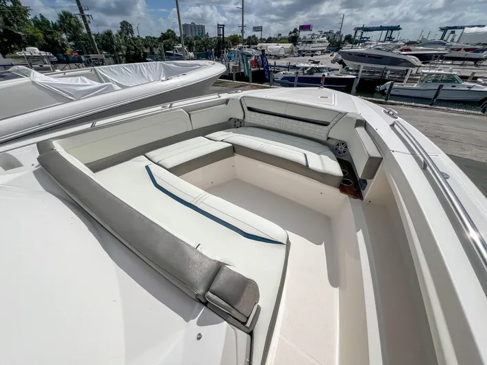  Yacht Photos Pics 2023 Tiara Yachts 38 LS boat with spacious seating at a marina.
