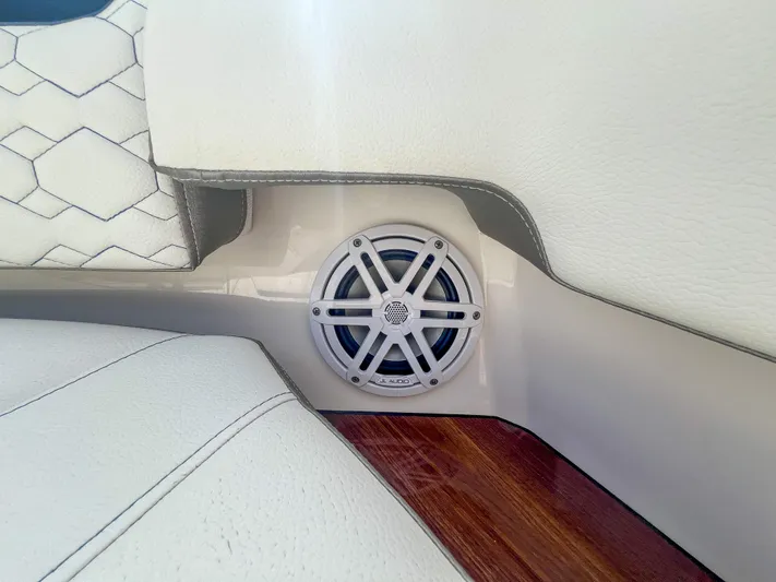  Yacht Photos Pics Speaker detail on 2023 Tiara Yachts 38 LS, featuring white upholstery and wood accents.