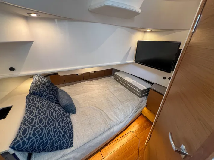  Yacht Photos Pics 2023 Tiara Yachts 38 LS cabin interior with bed, TV, and modern design.