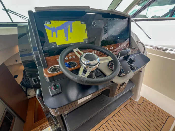  Yacht Photos Pics 2023 Tiara Yachts 38 LS helm with advanced navigation displays and steering wheel.