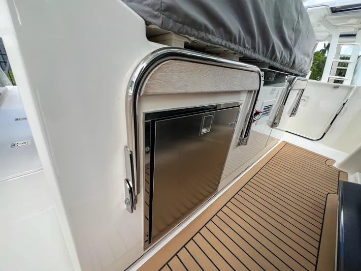  Yacht Photos Pics 2023 Tiara Yachts 38 LS, sleek stainless steel detailing, modern deck design.