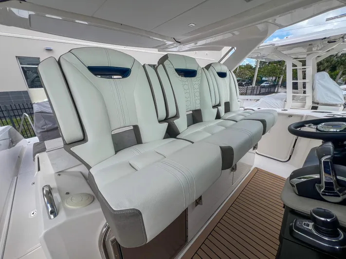 Yacht Photos Pics 2023 Tiara Yachts 38 LS interior with luxurious seating and modern helm controls.