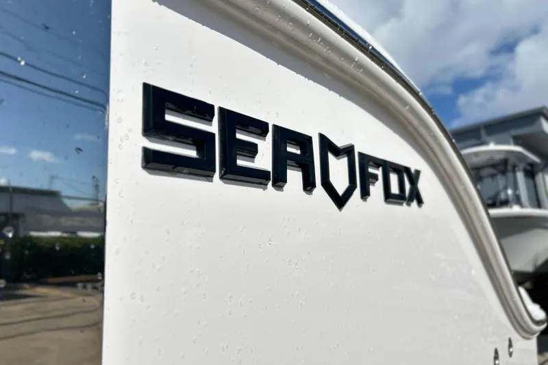  Yacht Photos Pics 2026 Sea Fox 288 Commander boat logo on sleek white surface.