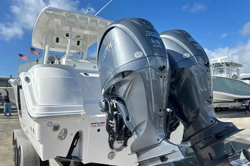  Yacht Photos Pics 2026 Sea Fox 288 Commander with dual Yamaha V6 engines, docked under clear blue sky.