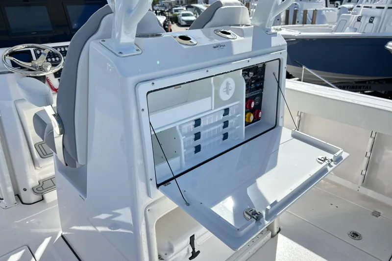 Yacht Photos Pics 2026 Sea Fox 288 Commander boat console with open storage and control panel.