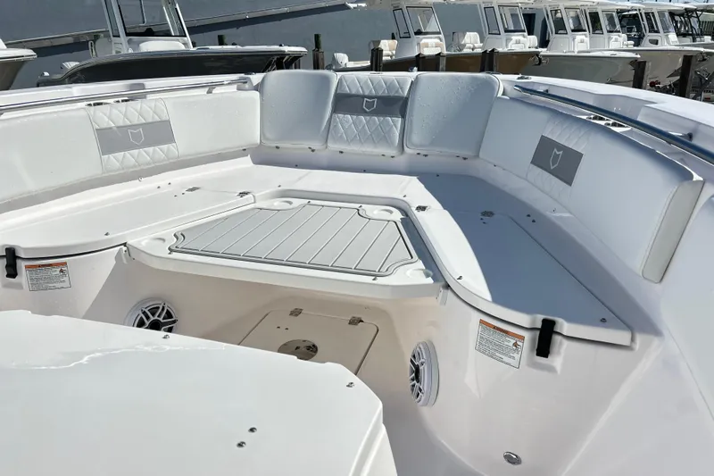 Yacht Photos Pics 2026 Sea Fox 288 Commander boat interior with cushioned seating and storage compartments.