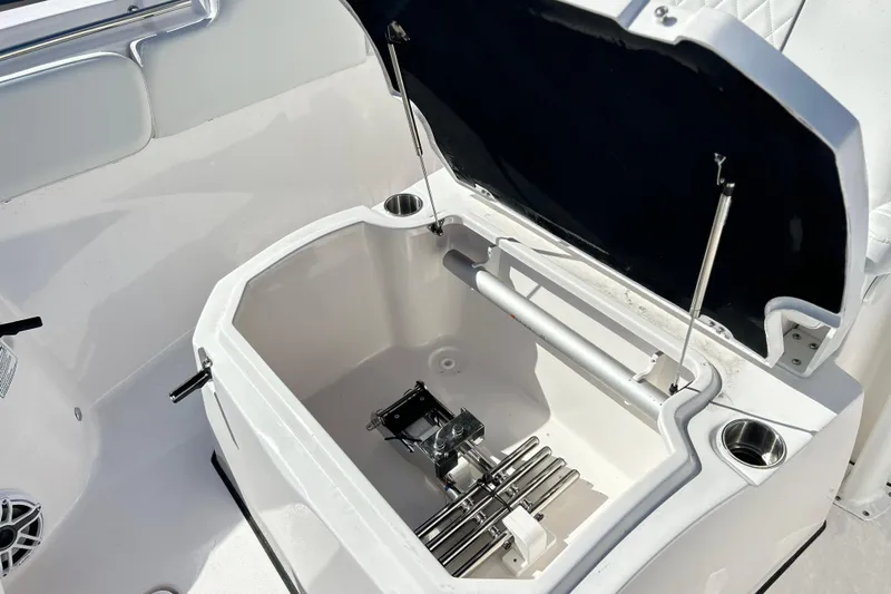  Yacht Photos Pics 2026 Sea Fox 288 Commander boat storage compartment with open lid and cup holders.