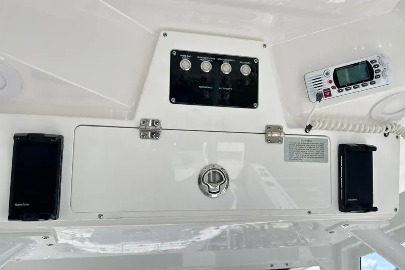  Yacht Photos Pics 2026 Sea Fox 288 Commander control panel with switches and radio equipment.