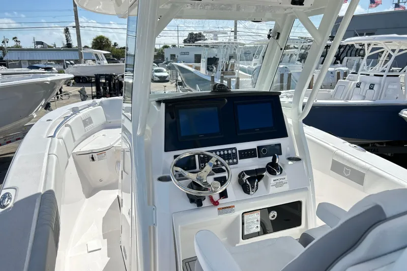  Yacht Photos Pics 2026 Sea Fox 288 Commander boat interior with dual screens and steering wheel.
