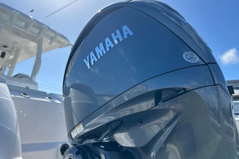 Yacht Photos Pics Yamaha outboard motor on 2026 Sea Fox 288 Commander boat under clear blue sky.